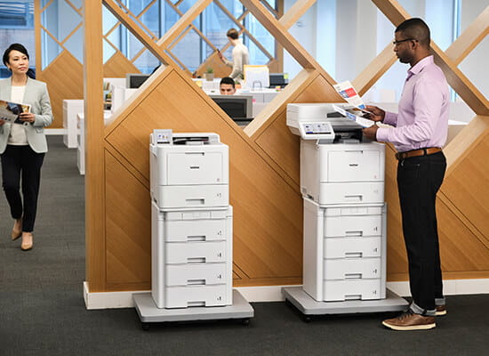 People in office using Brother HL-L9470 and MFC-L9670 printers