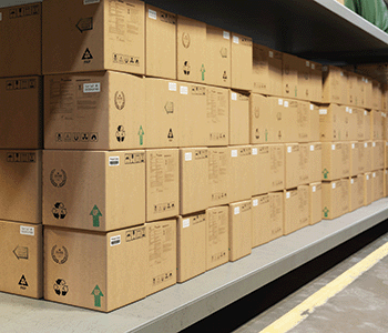 Boxes on warehouse shelves utilizing labels printed on QL-1100C label printer
