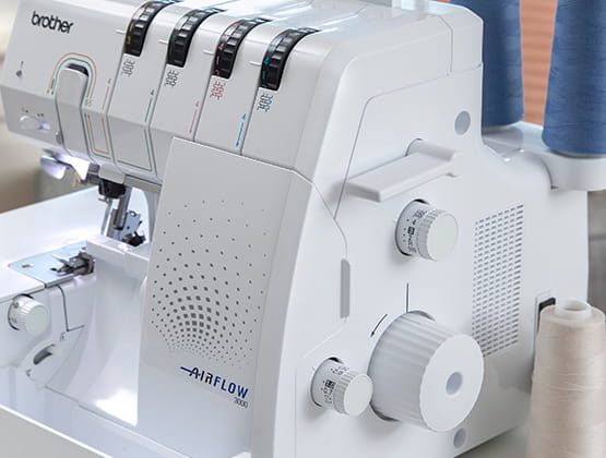 Side angle of serger showing the controls for multi-needle usage