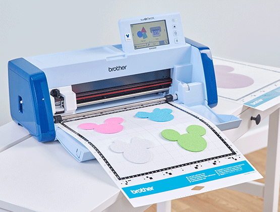 SDX330DI machine on table with Mickey Mouse designs on mat