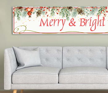 Merry & Bright sign made with PrintModa above a tufted couch 