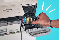 Person changing ink cartridge in PrintModa fabric printer
