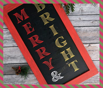Merry & Bright sign against a wooden background