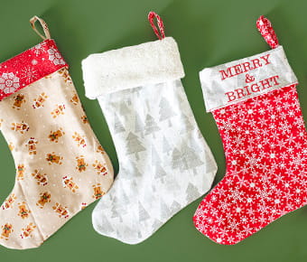 Christmas stockings on green background