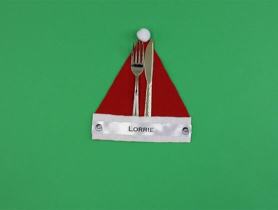 Fork and knife in completed Santa hat flatware holder
