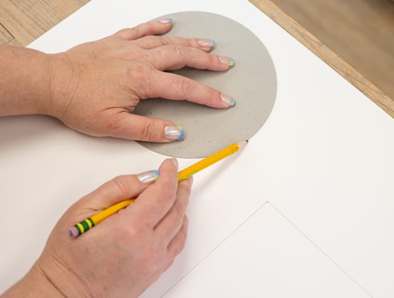 P-touch Embellish Craft Step 1 person drawing circles on paper